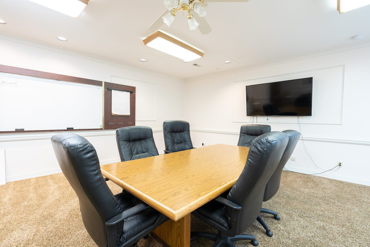 A conference room/meeting space with a conference table